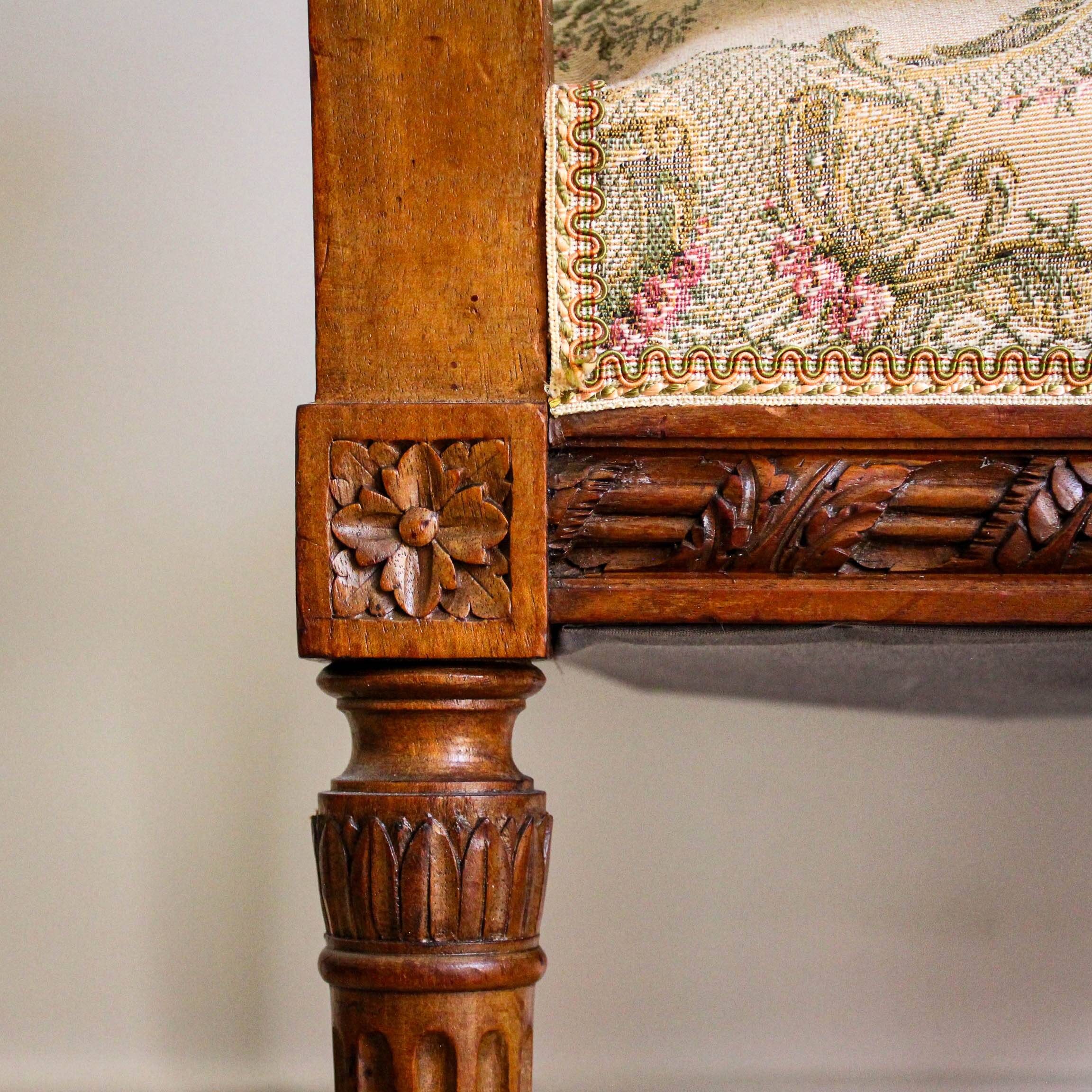 Louis XVI style carved armchair