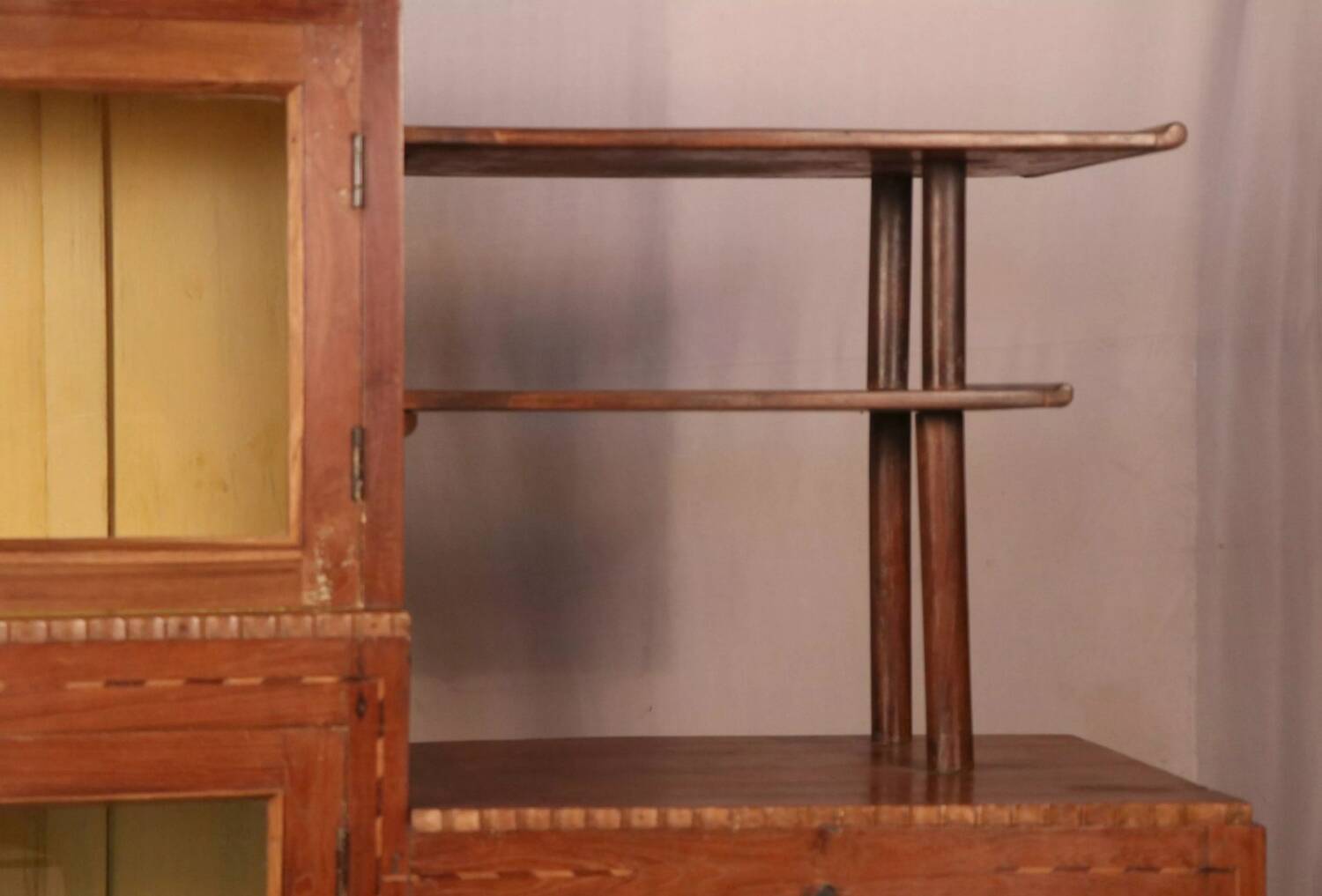 Antique Art Deco display cabinet in Burmese teak with original yellow patina interior.