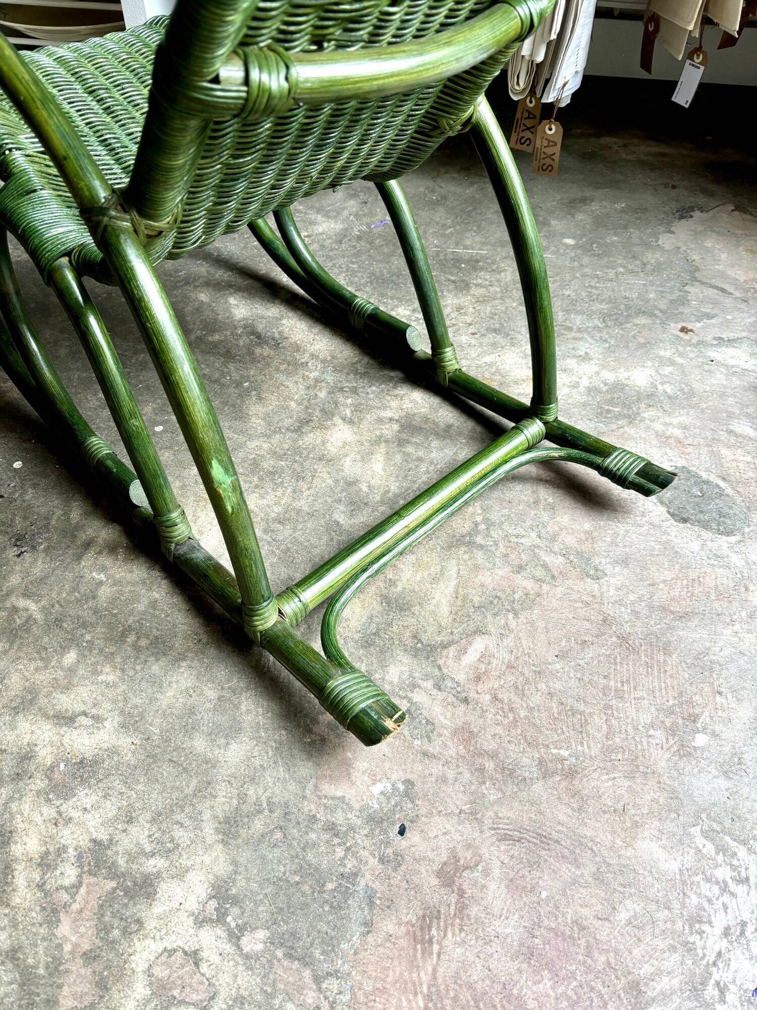 Children's rocking chair in woven wicker and green rattan