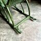 Children's rocking chair in woven wicker and green rattan