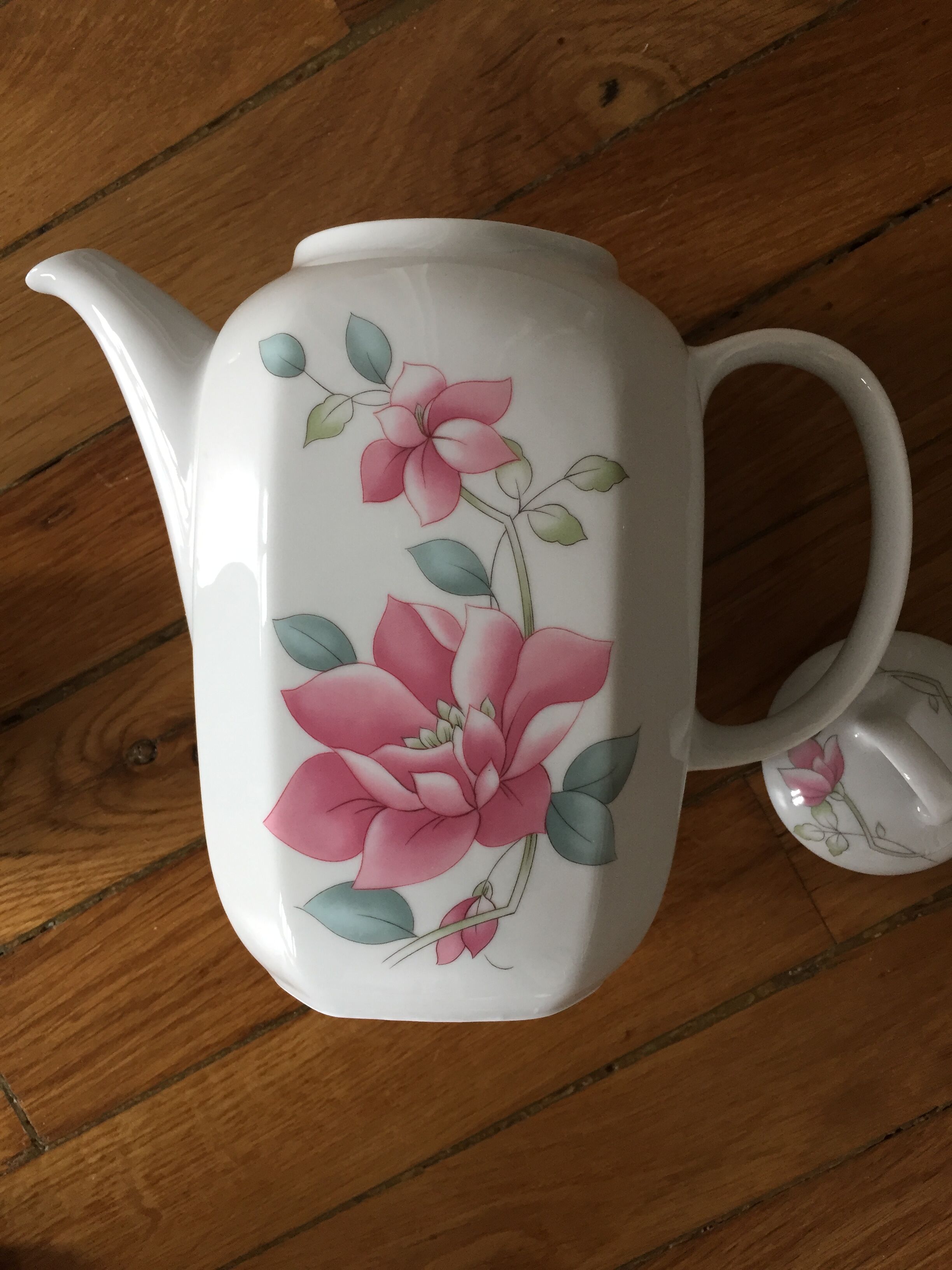 Vintage porcelain coffee or teapot with milk jug