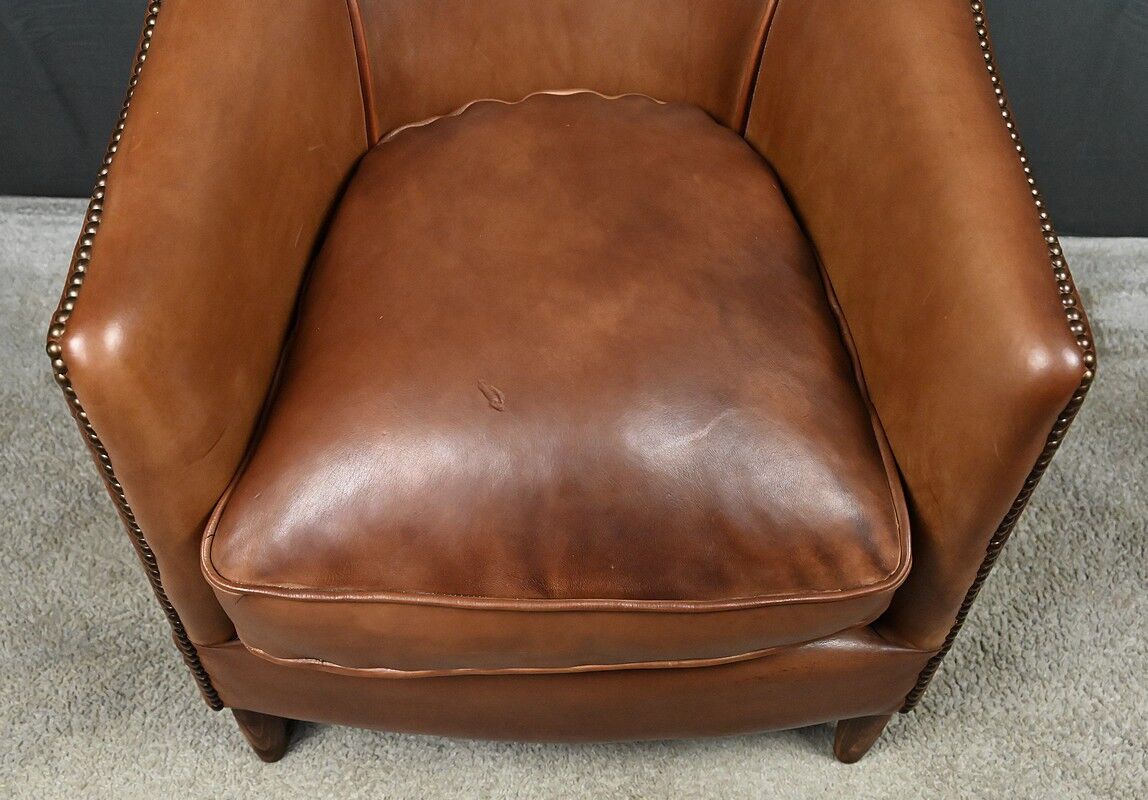 Solange club armchair in sheepskin leather.