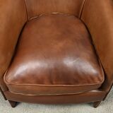 Solange club armchair in sheepskin leather.