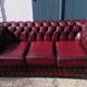Burgundy Chesterfield-style sofa