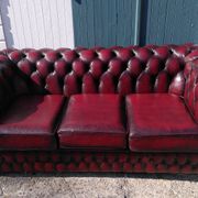 Burgundy Chesterfield-style sofa