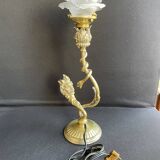 Old table lamp in bronze and brass gilded with satyr and snake