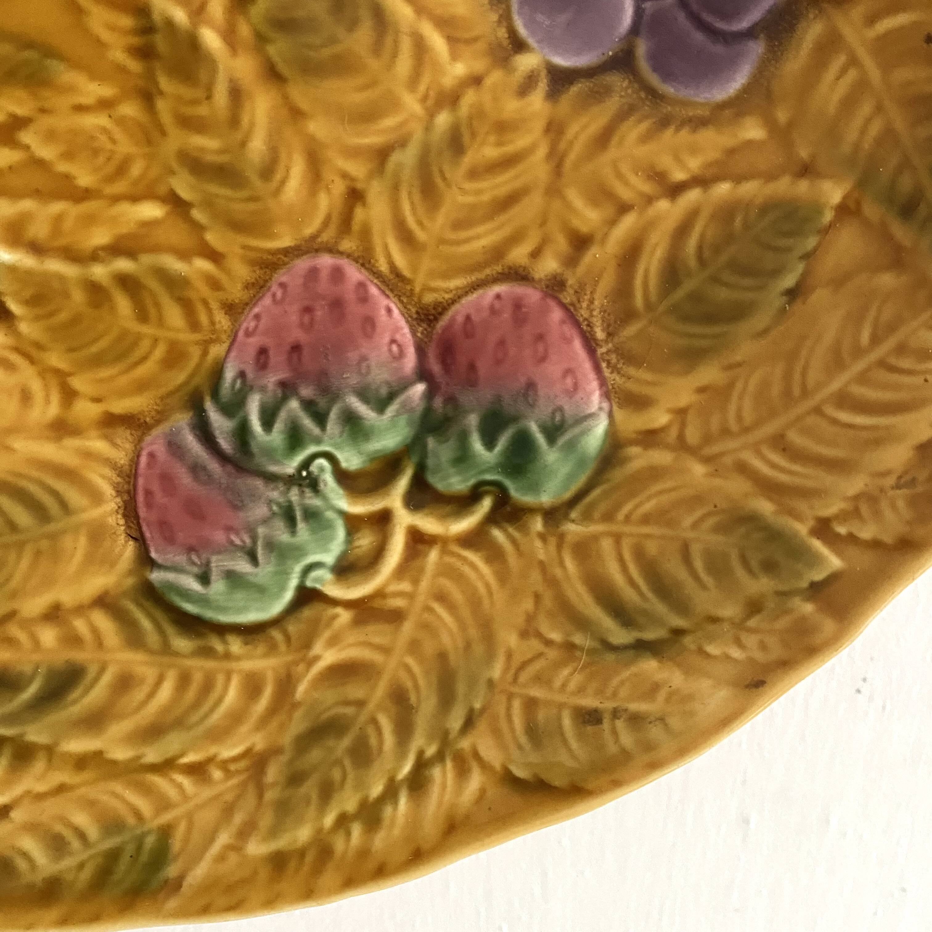 Large round Sarreguemines slip dish with fruit decoration