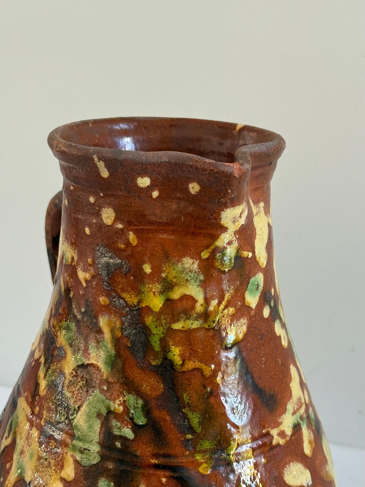 Studio ceramic pitcher with sprayed glazes – circa 1960-70