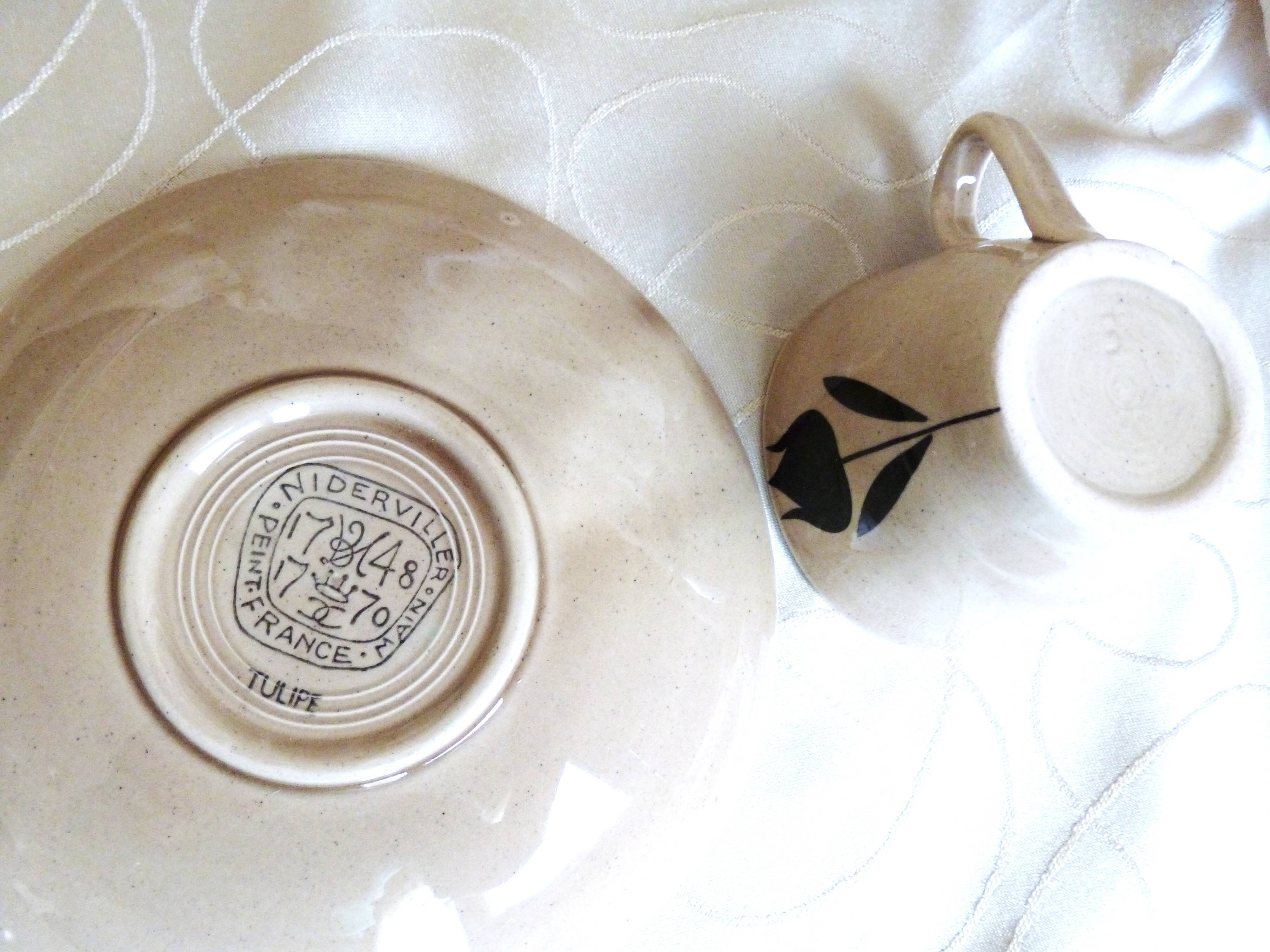 Vintage 23-piece Niderviller coffee set with hand-painted black tulip decor.