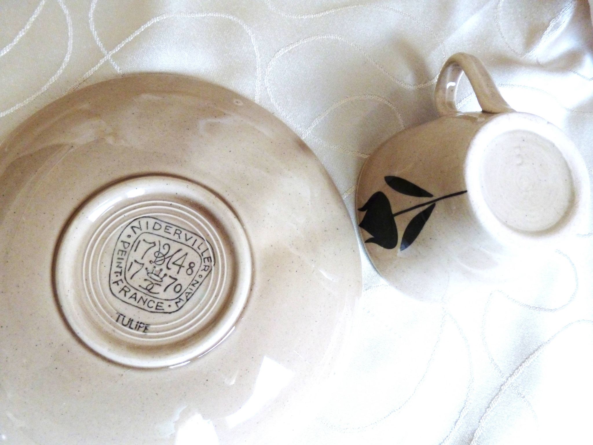 Vintage 23-piece Niderviller coffee set with hand-painted black tulip decor.