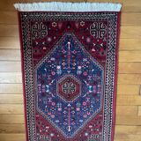 Small Persian wool rug