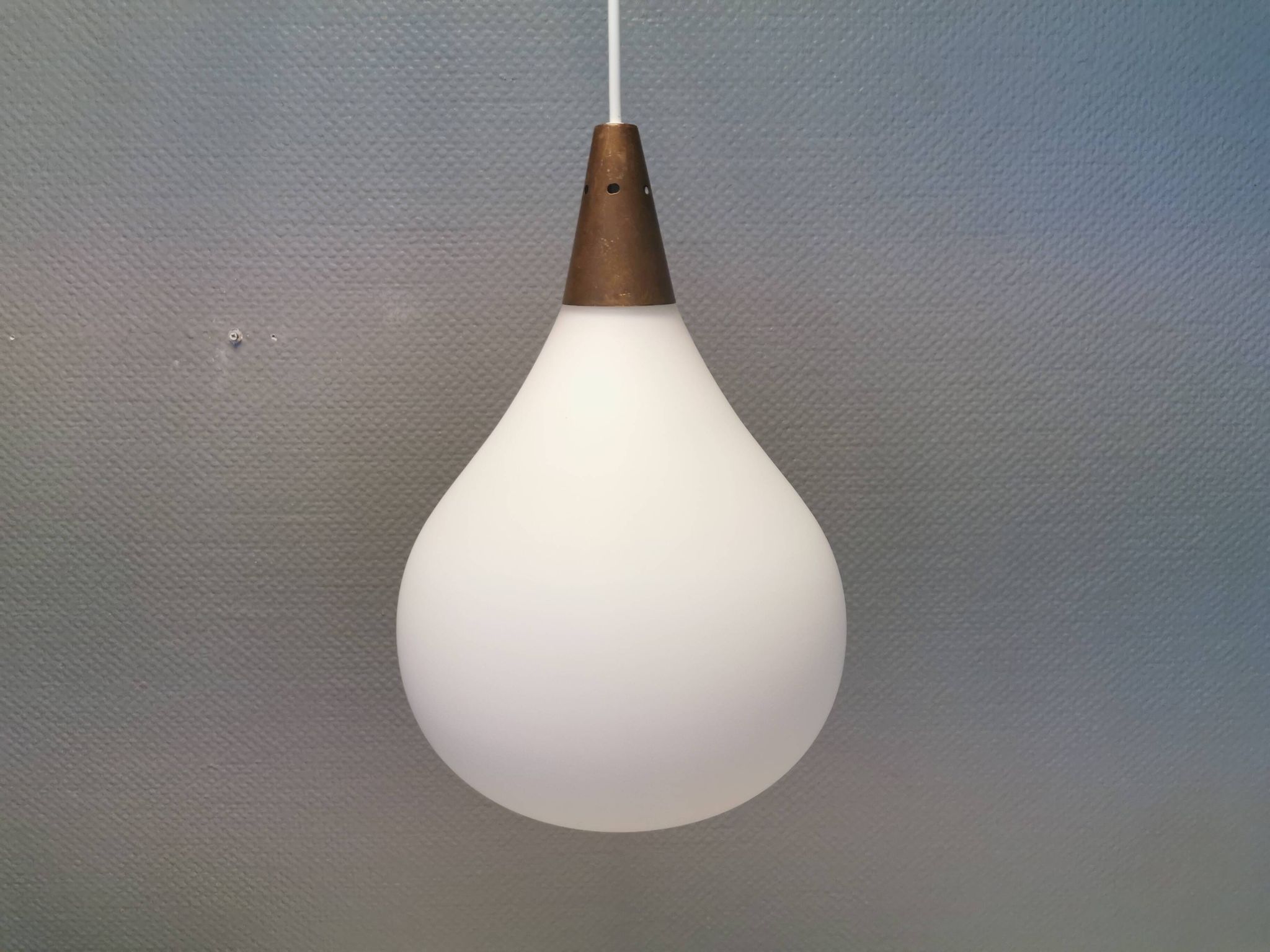 Large hanging lamp in white opal glass with brass top. Danish and estimated from the 1970s.