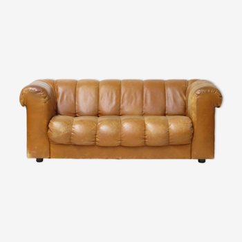 Mid century 2.5 seater sofa in thick cognac buffalo leather, 1970s.