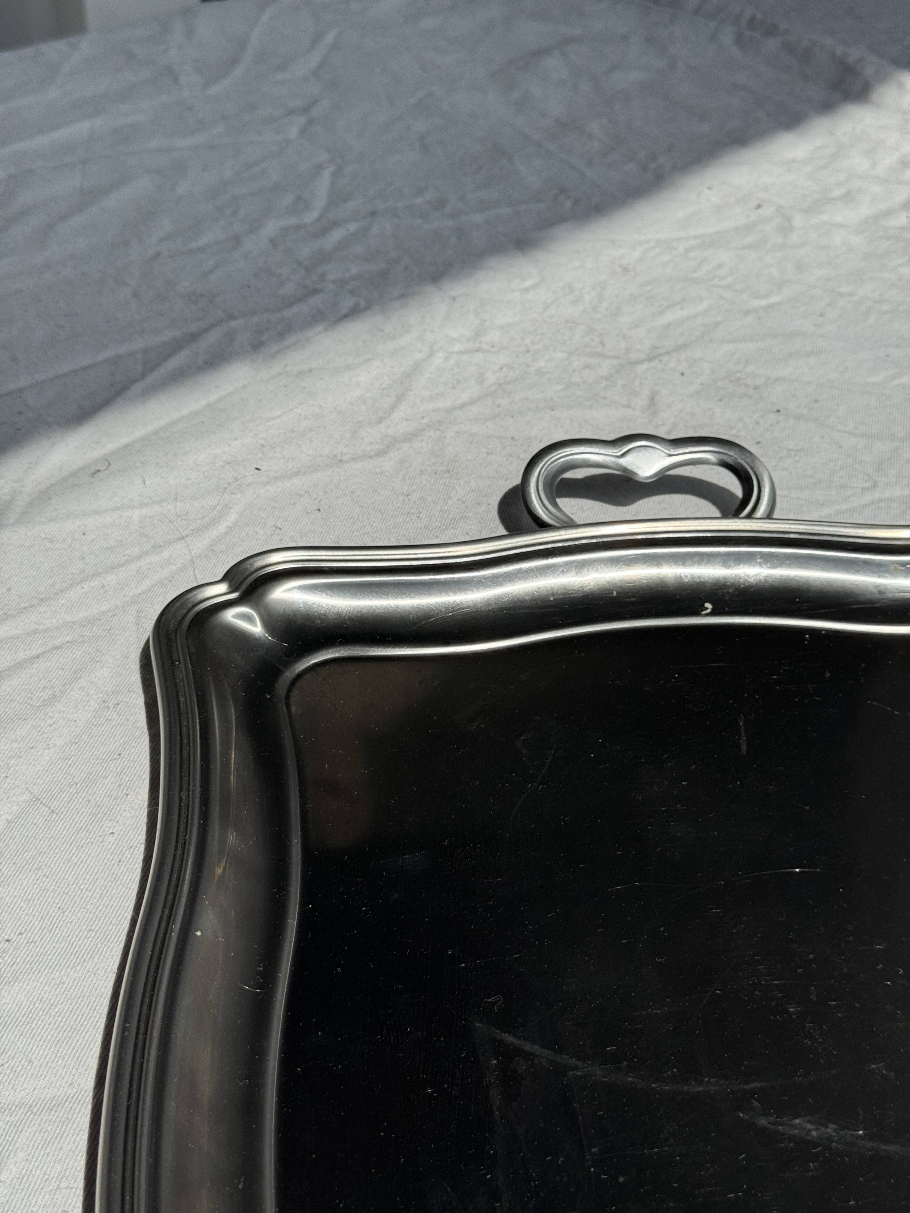 Guy Degrenne silver stainless steel serving tray with an eventful shape