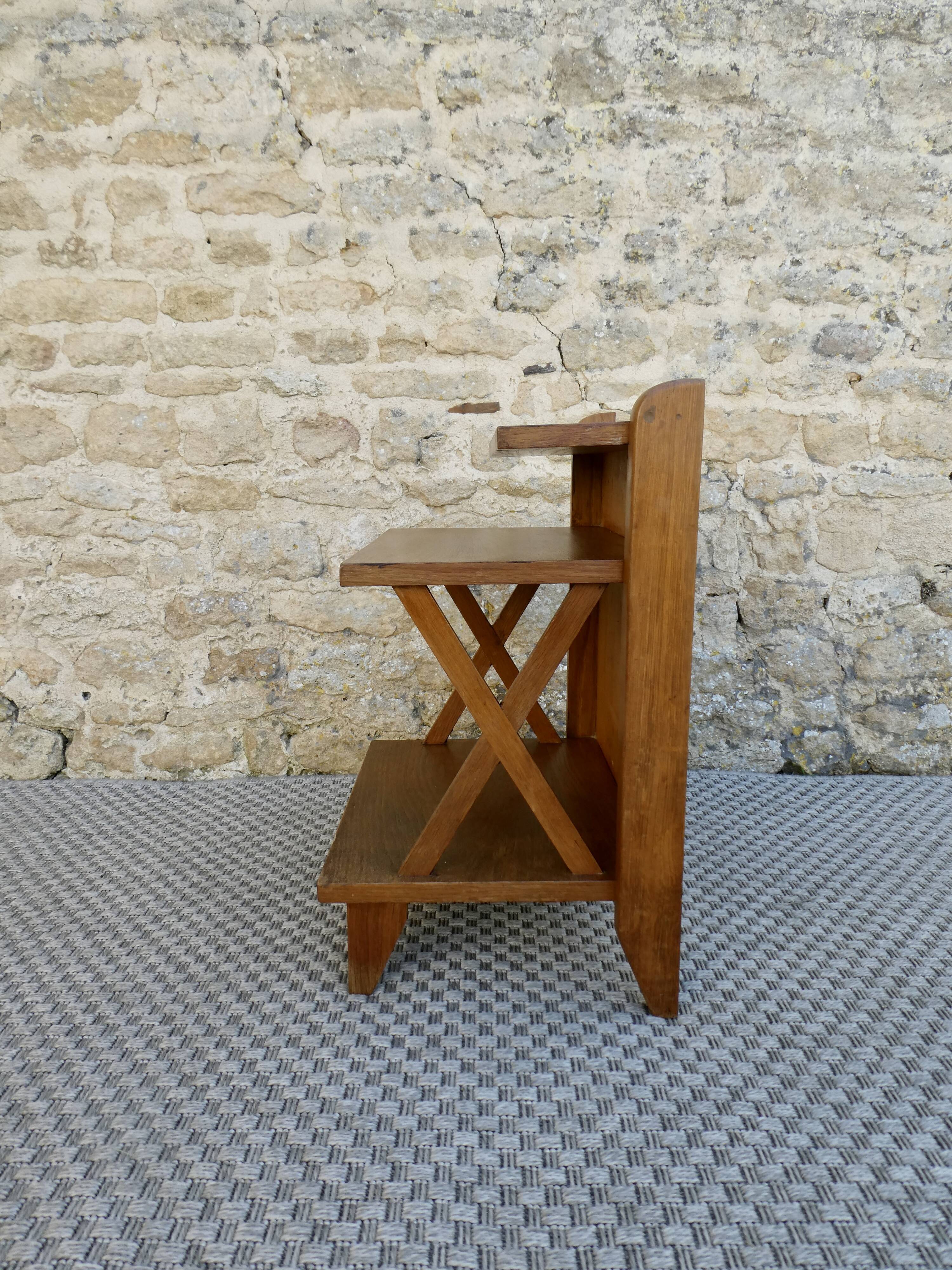 Light wood bedside table with crossbars and 3 shelves, around 1950.
