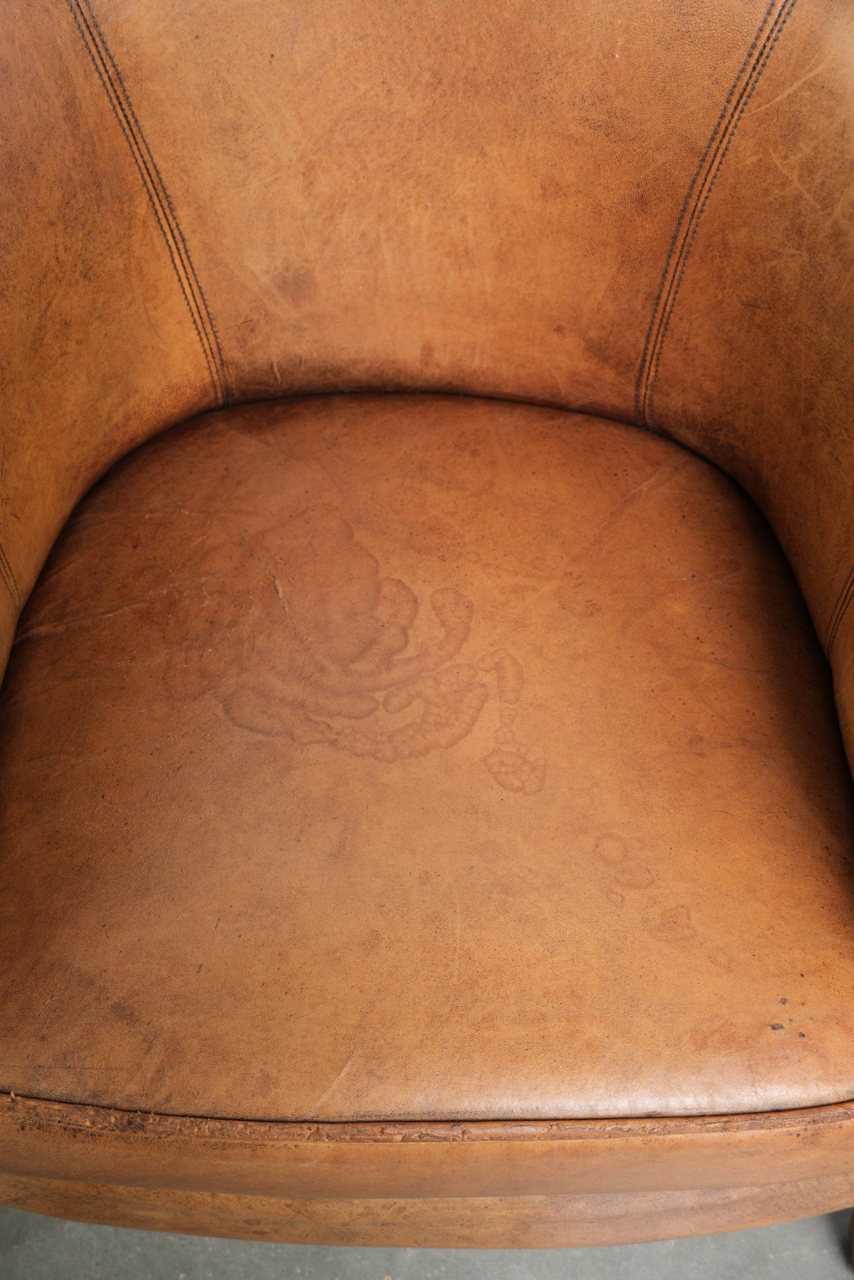 Set of two vintage sheepskin club armchairs with a beautiful light colour