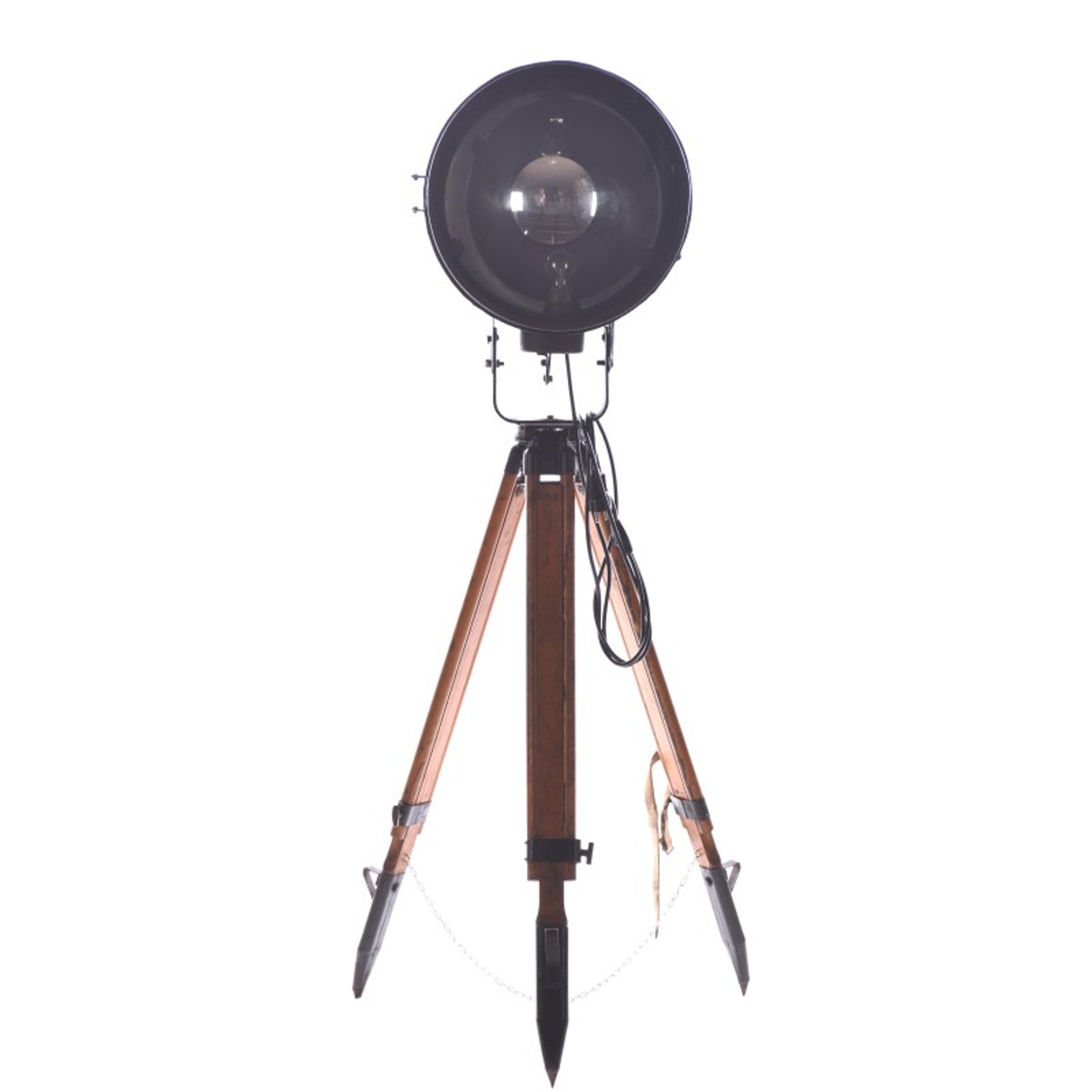 Old industrial spot on wooden tripod