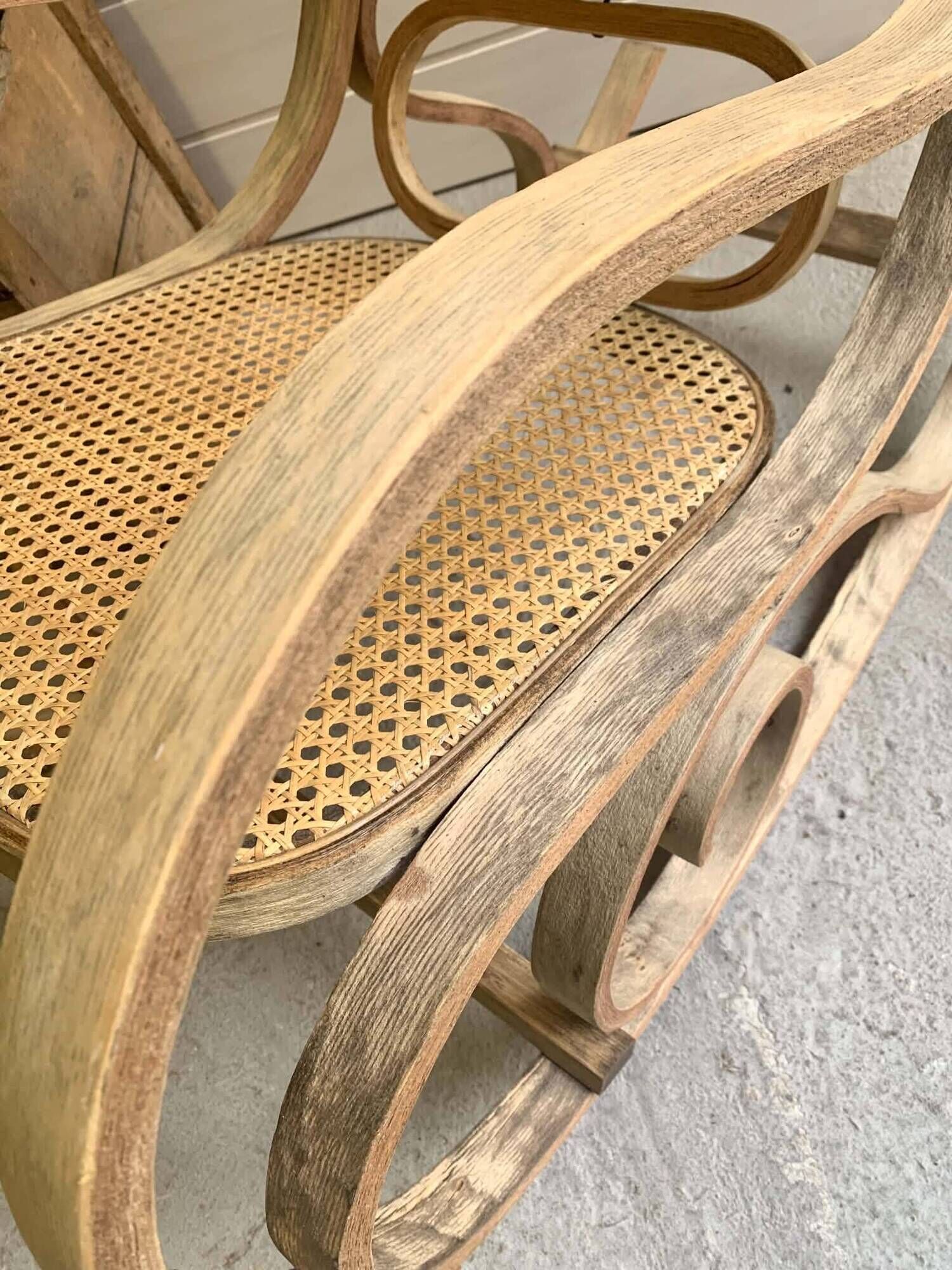 Rocking chair with a cane seat and backrest.