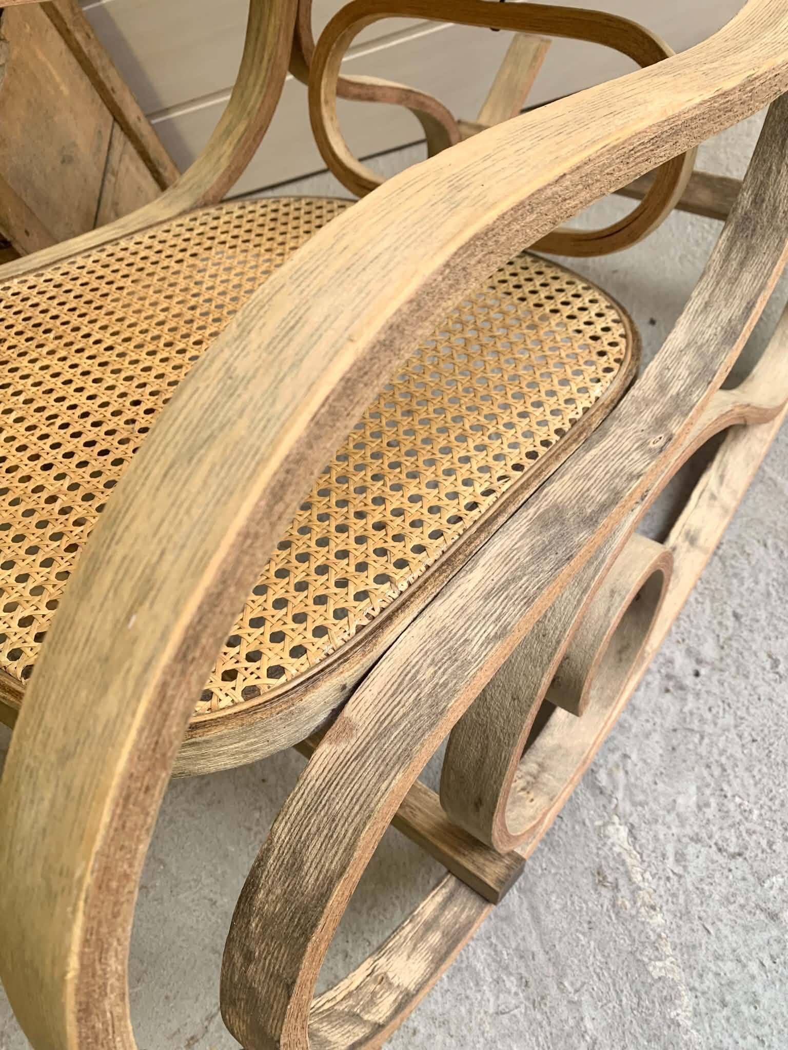Rocking chair with a cane seat and backrest.