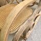 Rocking chair with a cane seat and backrest.