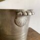 Antique champagne bucket with shell handles.