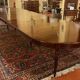 Extensible dining table from the Louis XVI period in mahogany with a banded top.
