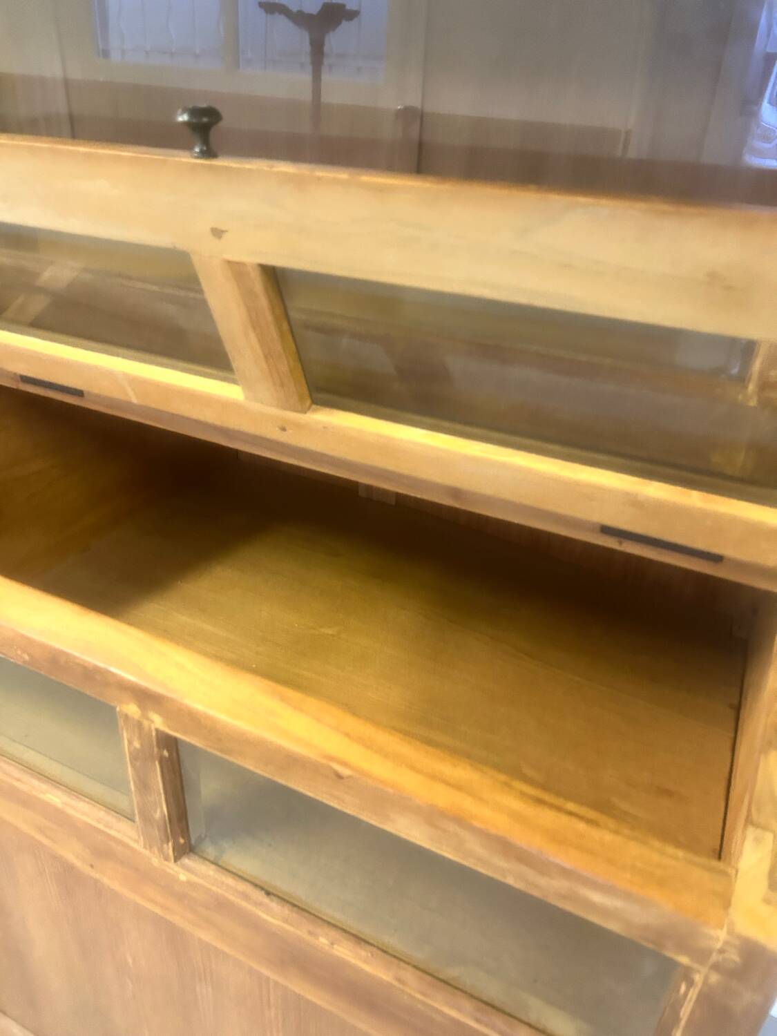Large antique haberdashery cabinet with glass doors.