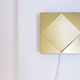 Golden wall light Raak