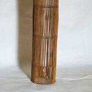 Mid-century rattan floor lamp, in the style of Louis Sognot.