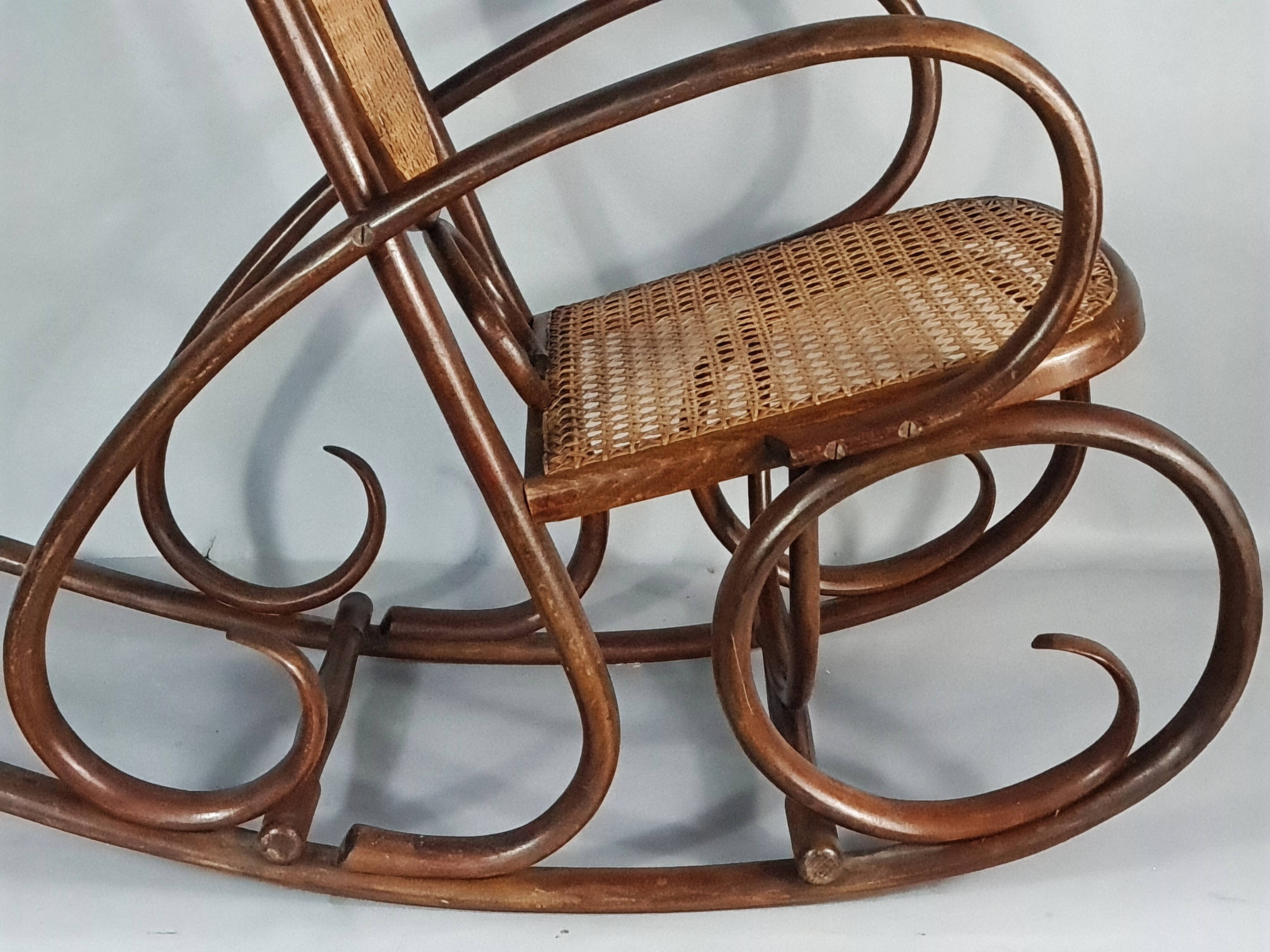 Vintage curved wood rocking chair for children with recent caning model D912.