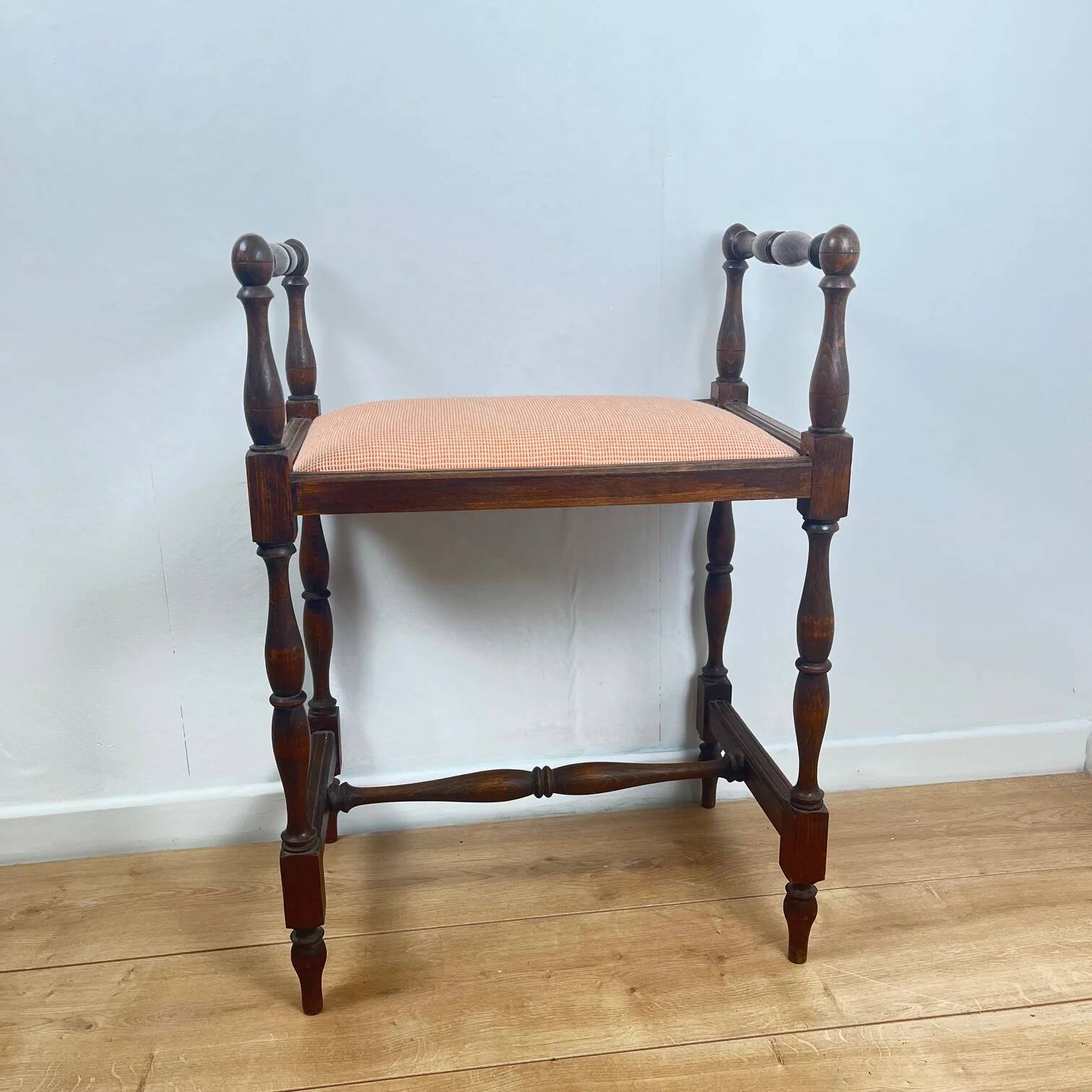 Small bench / stool in traditional English style, with side armrests.