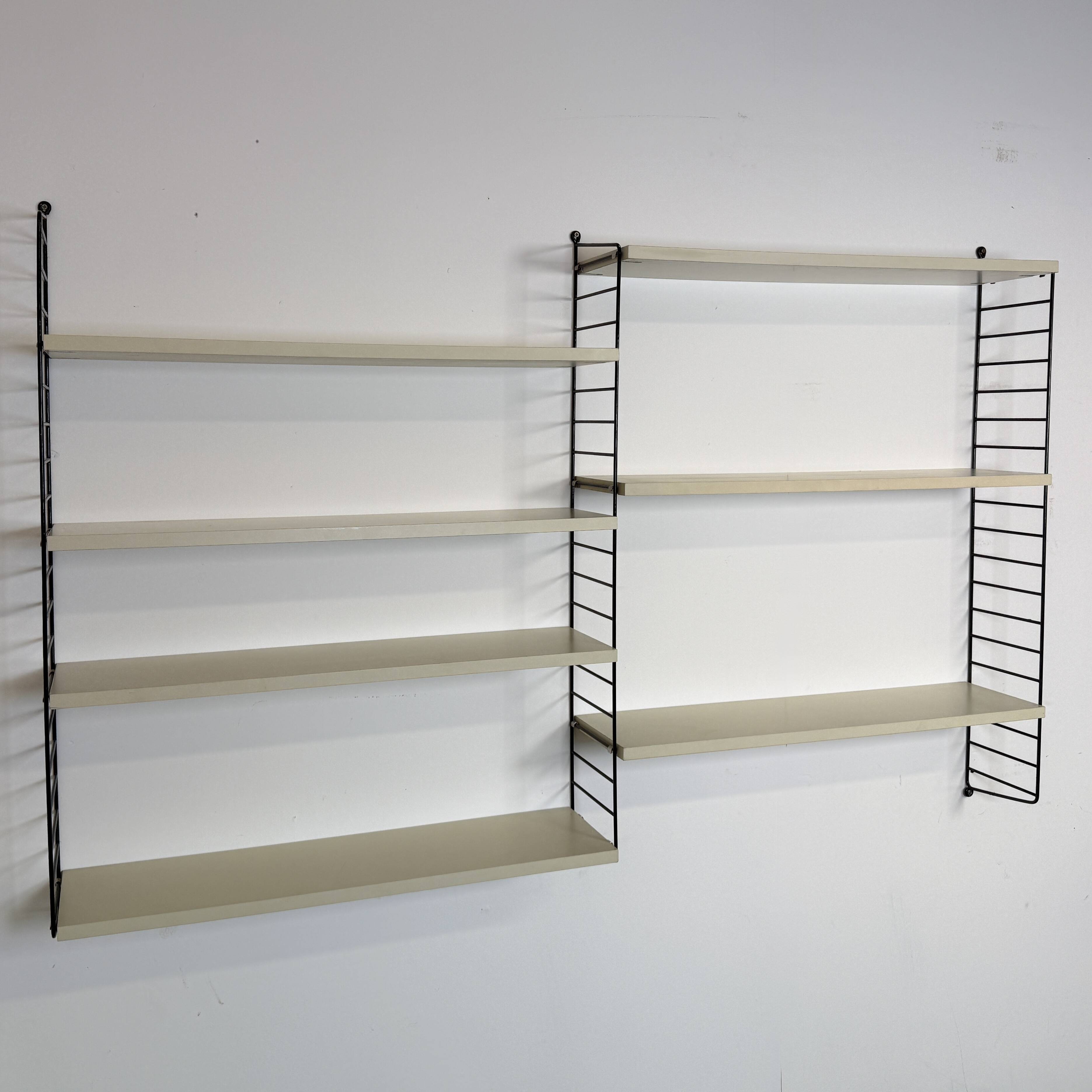 Vintage Nisse Strinning wall rack with 7 off-white shelves