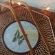 Rattan basket/tray/coin tray with a collection butterfly.