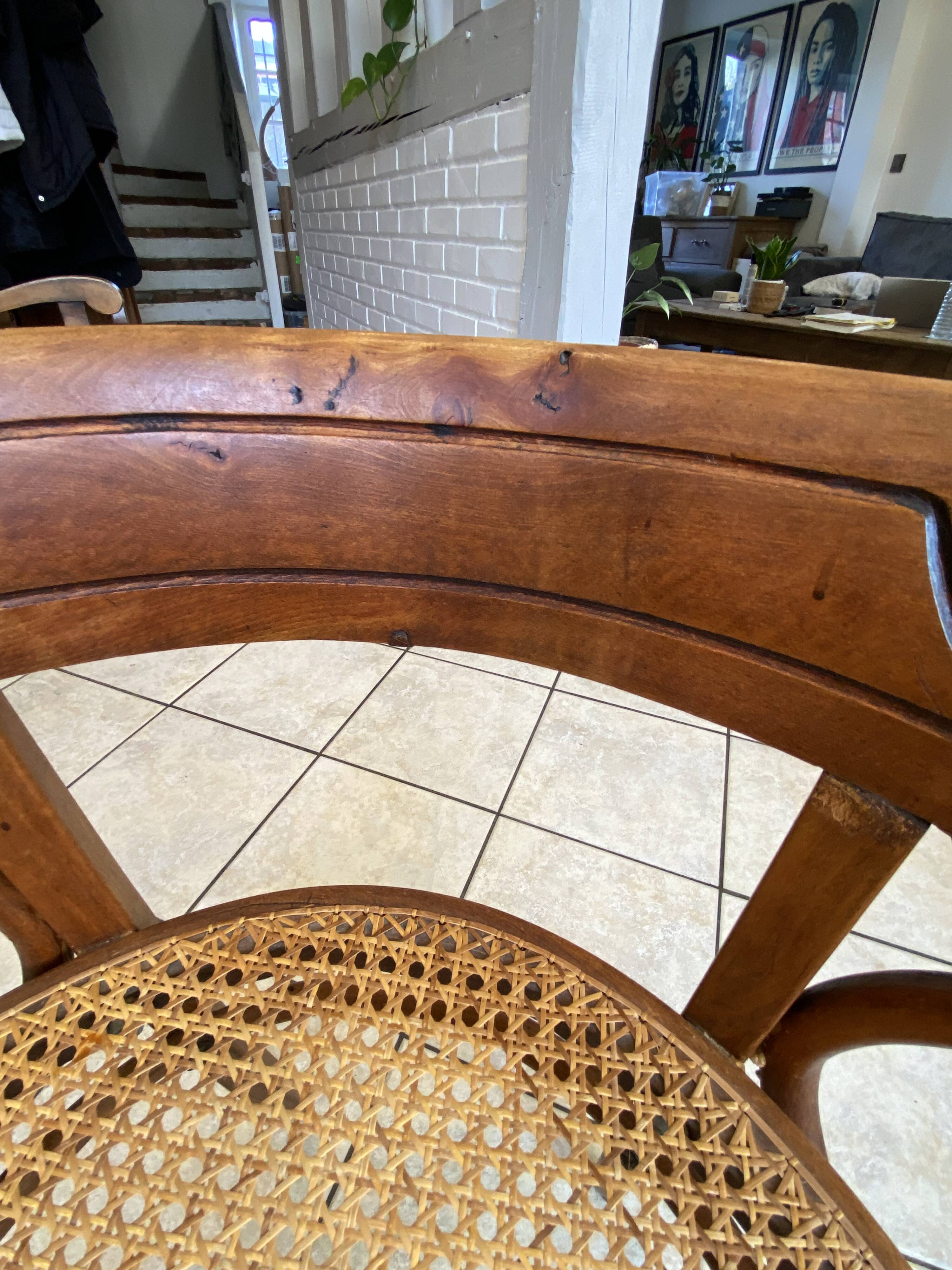Bistro chair with a curved wooden frame and caned seat from the 1930s.