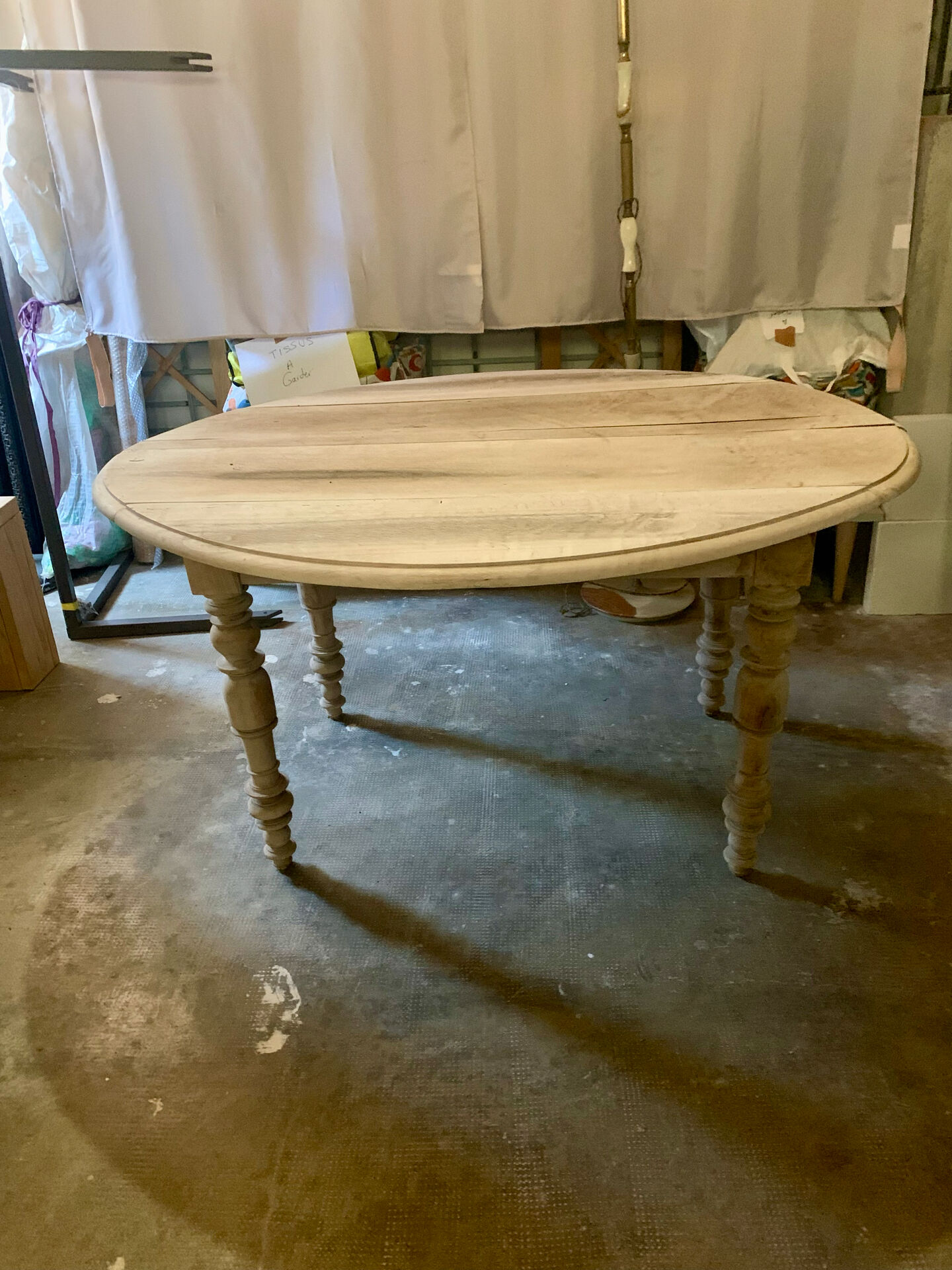 Oval drop-leaf table