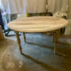 Oval drop-leaf table
