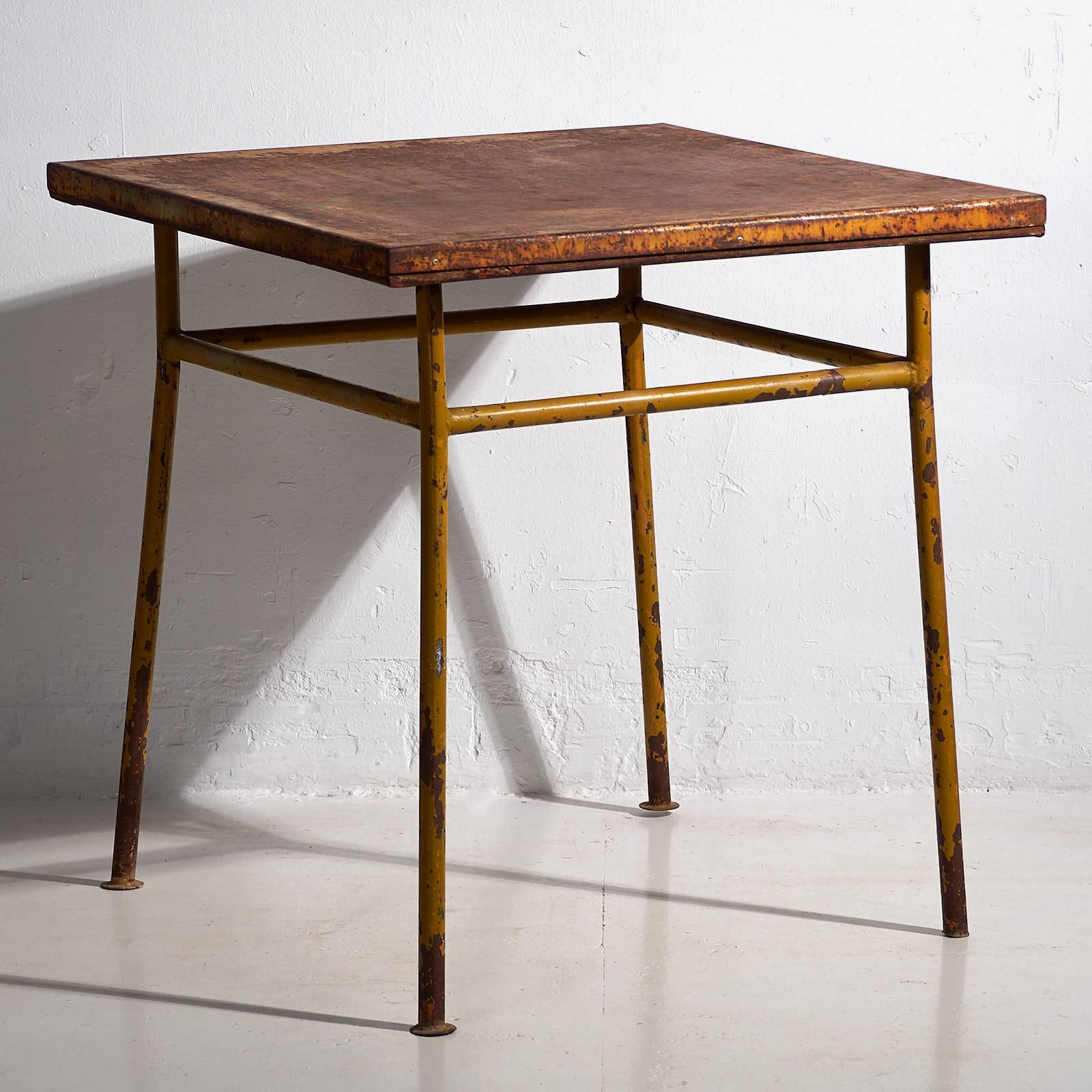 Antique ochre-colored outdoor table (c.1920)