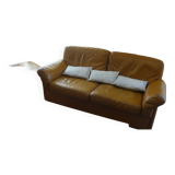 Tan leather sofa with natural graining, matching armchair and pouf