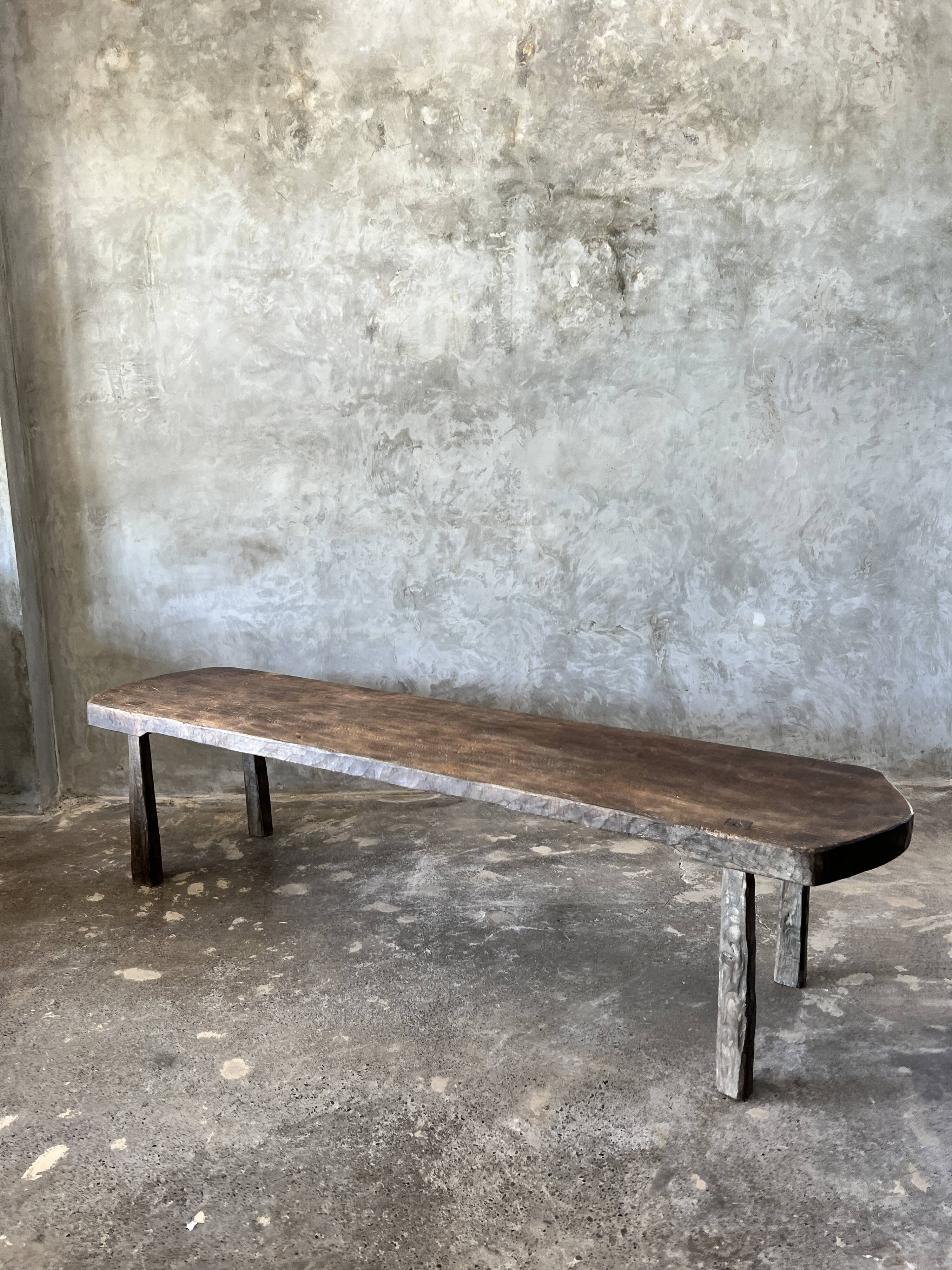 Large rounded coffee table in old Asian teak