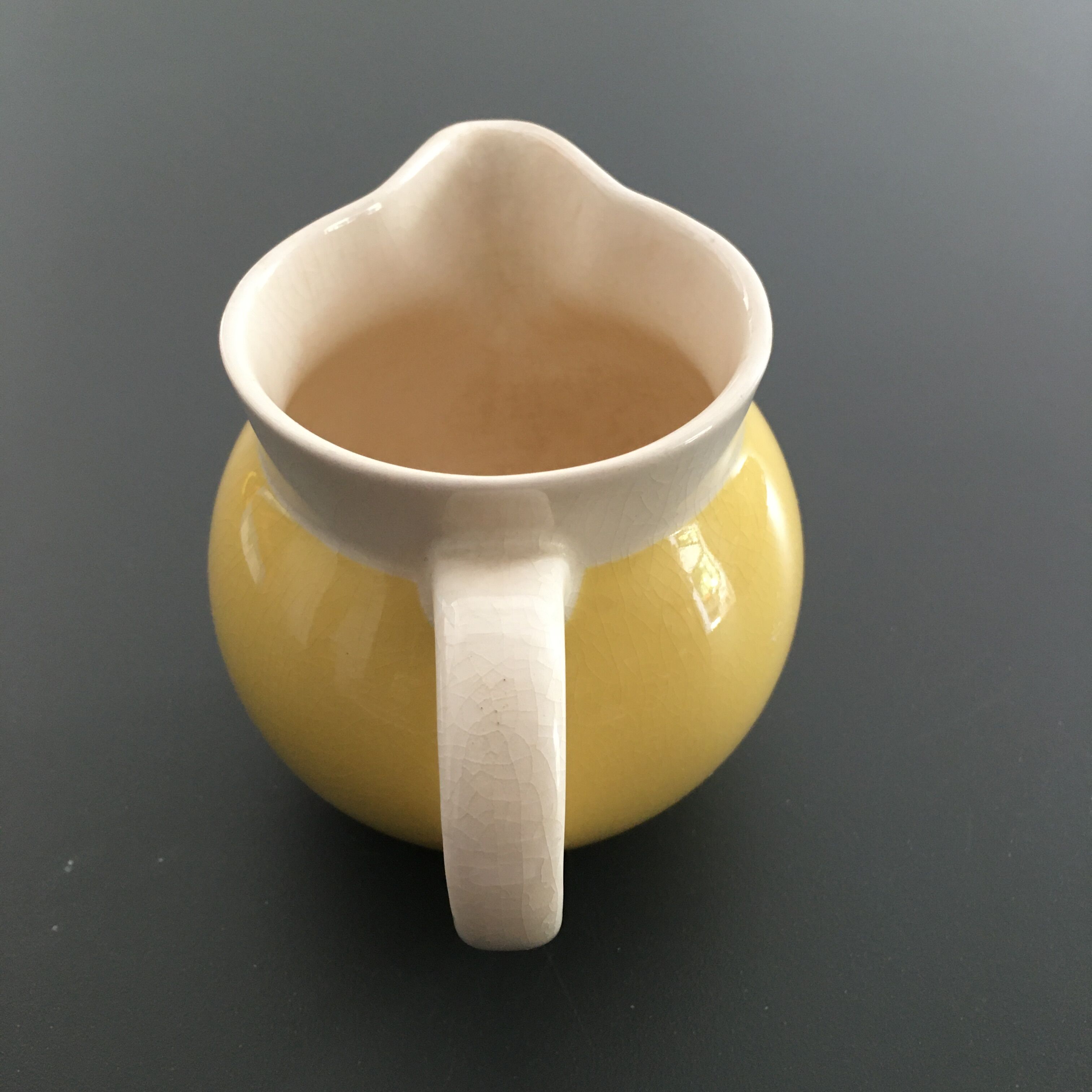 Yellow straw and ivory pitcher