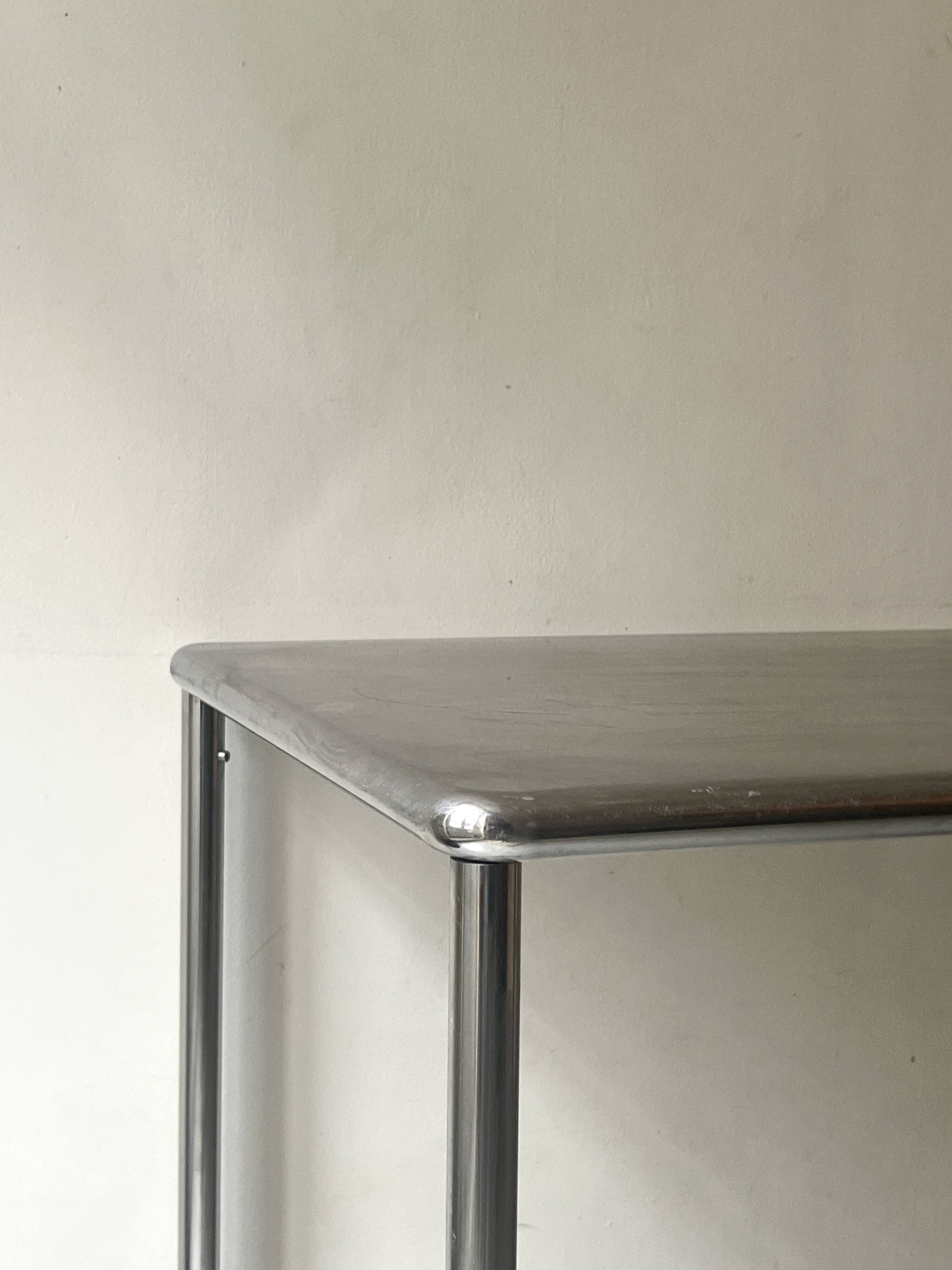 Dining table / tubular and modernist desk in chrome metal