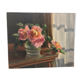 Table bouquet of roses in front of the window