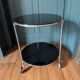 Vintage side table on wheels – black glass top