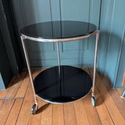 Vintage side table on wheels – black glass top