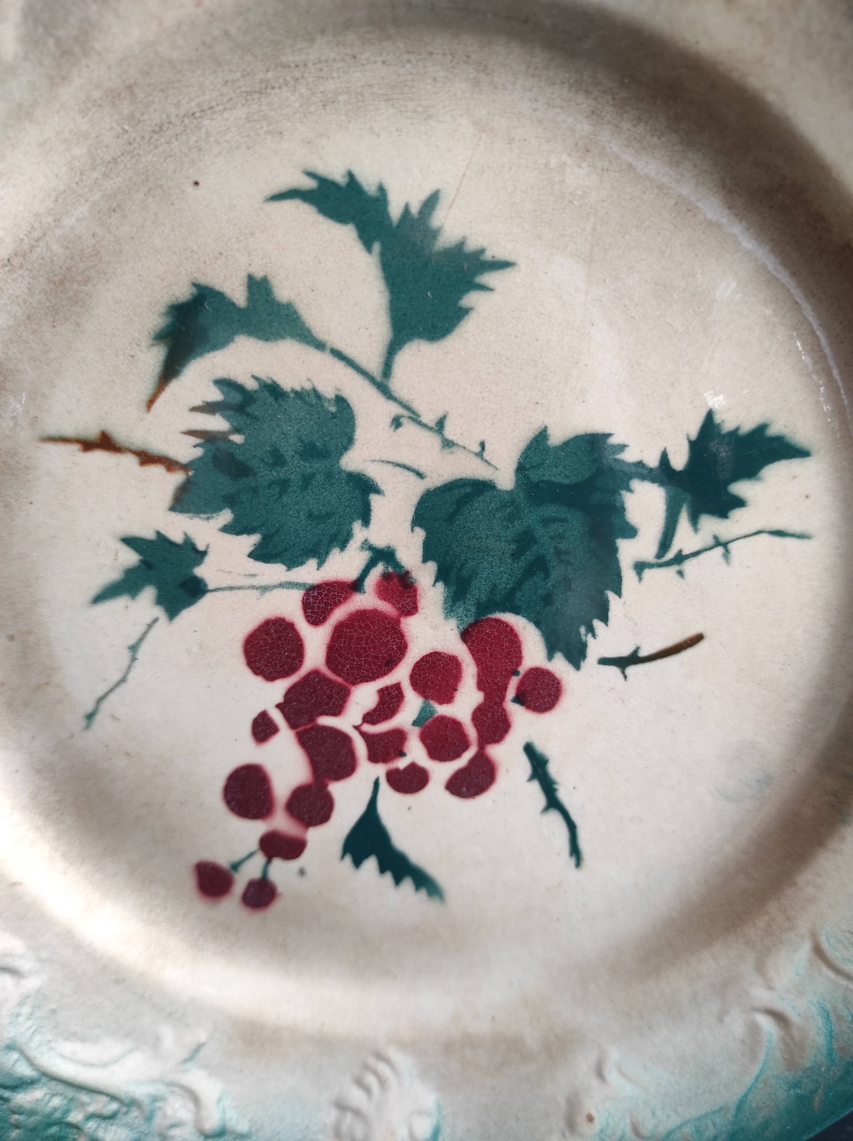 French antique barbotine plate decorated with stencil of grapes, faience de Castres