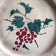 French antique barbotine plate decorated with stencil of grapes, faience de Castres