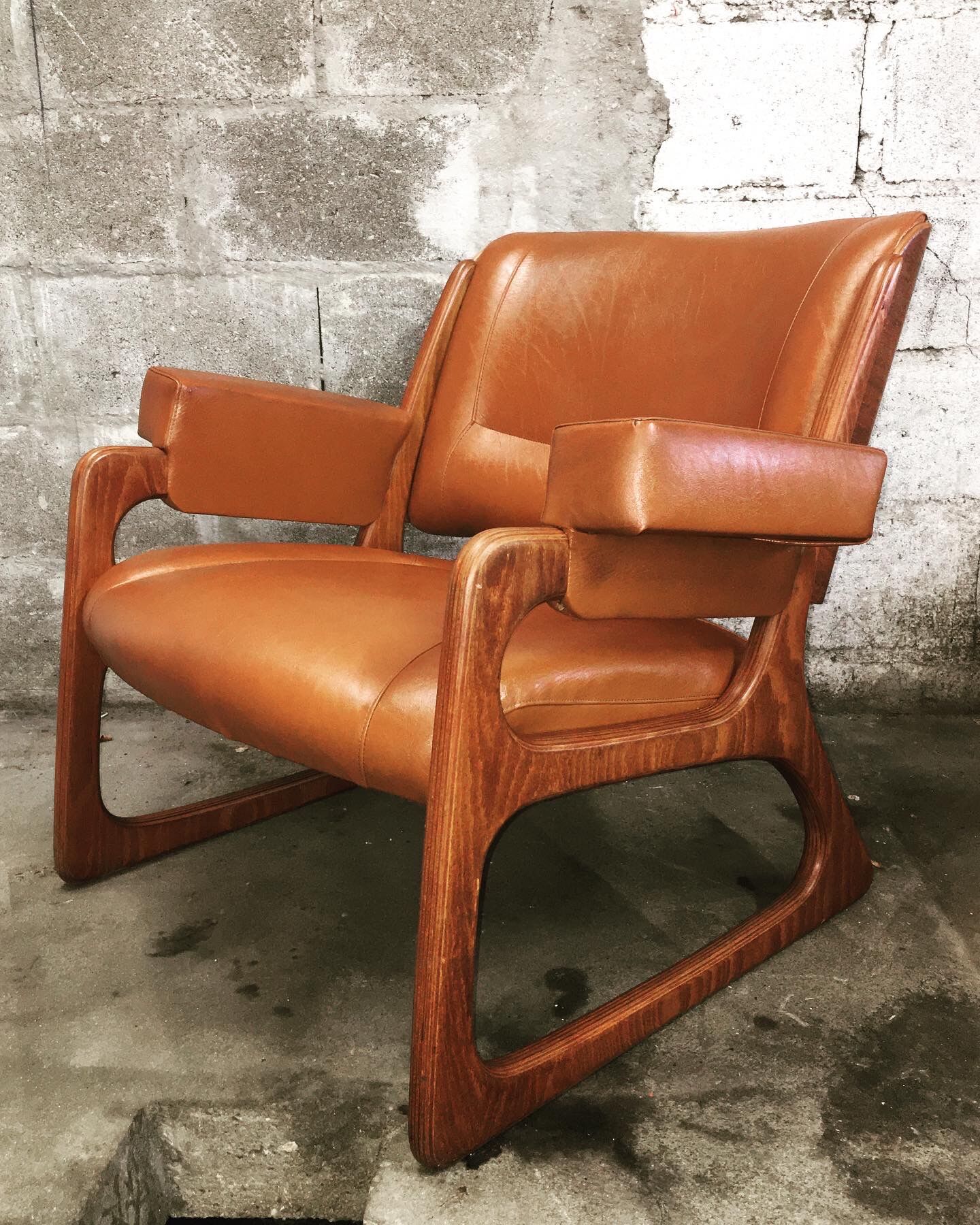 Armchair called "sled" Publisher Baumann and Ottoman