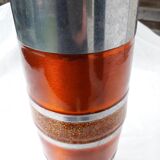 Orange and grey metal vase