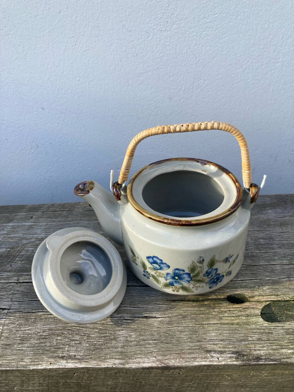 Chinese ceramic and rattan teapot