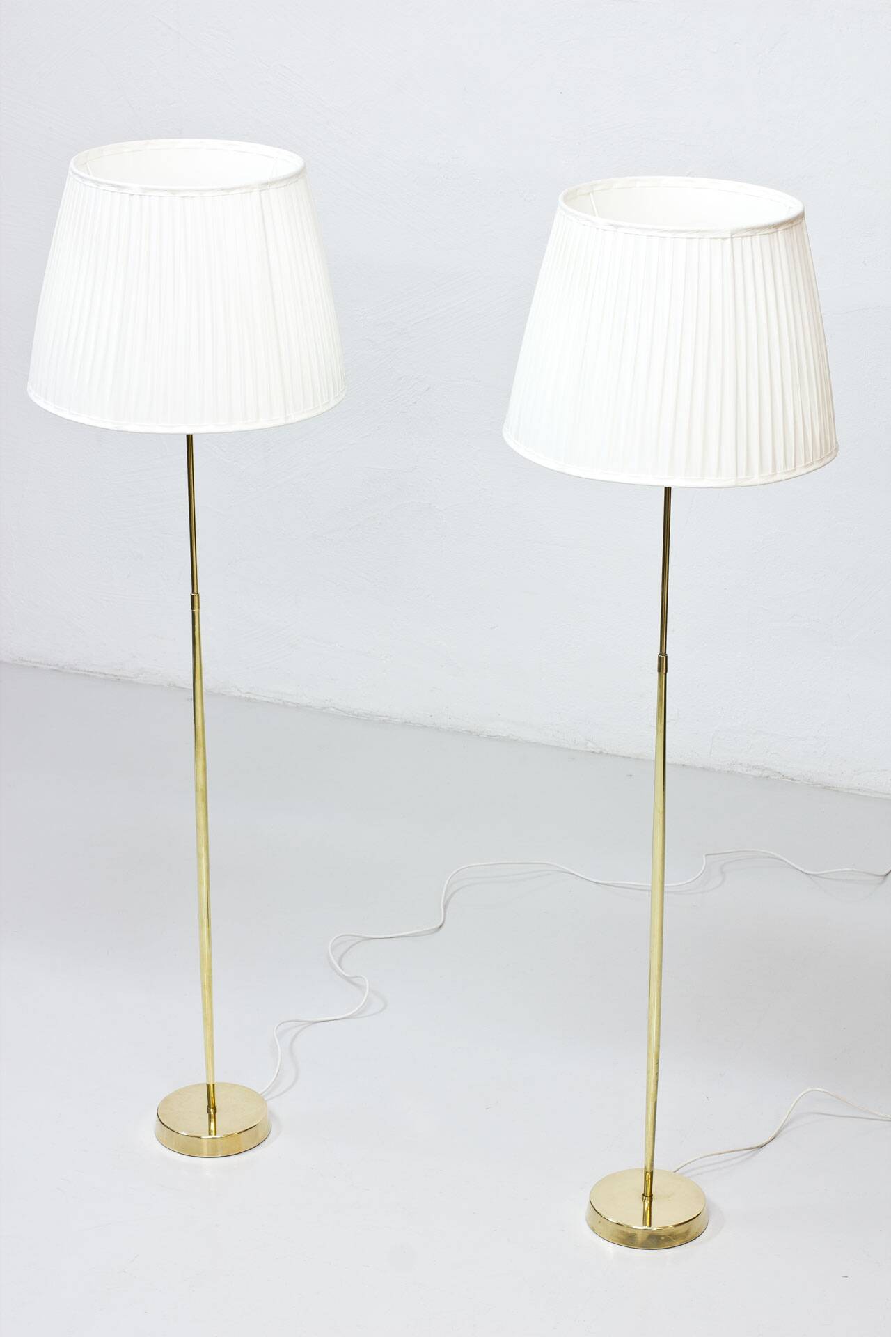 Pair of brass floor lamps by ASEA Belysning, Sweden, 1950s